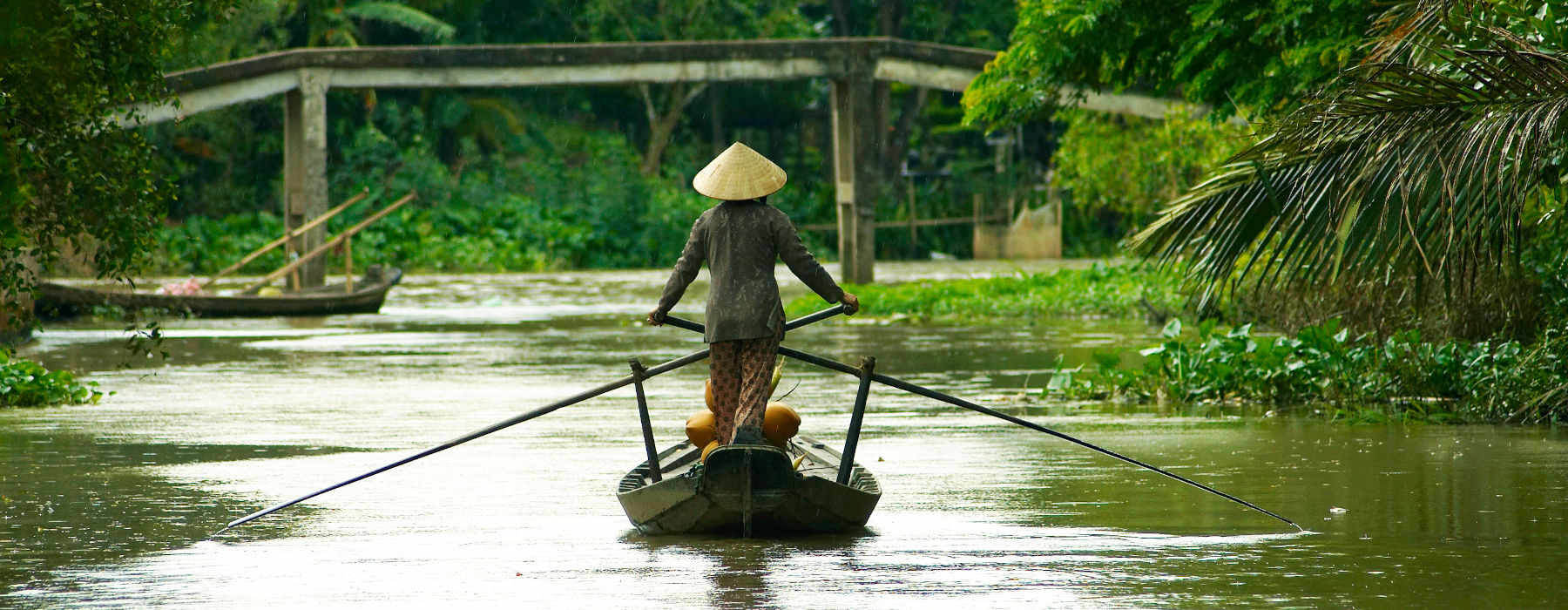 Rowing sampan at the Mekong river 