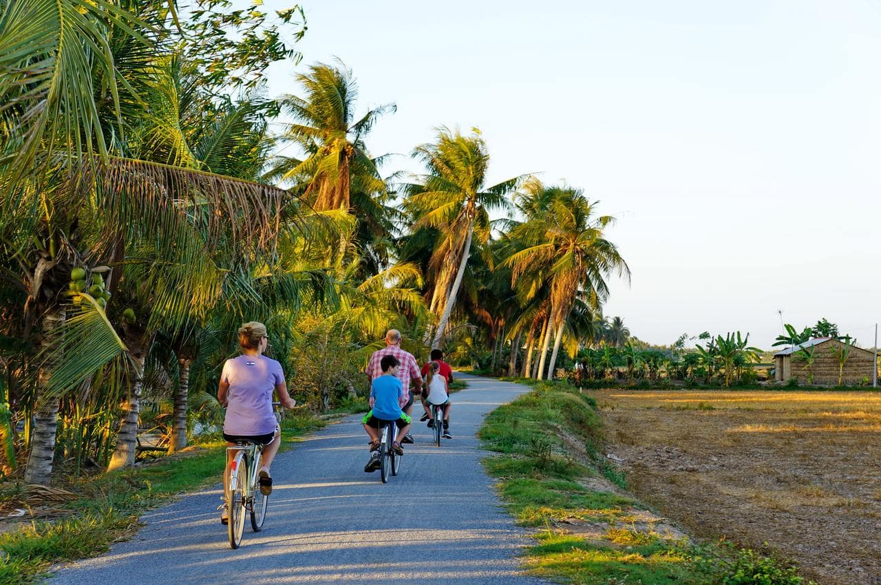 Experience biking around the local village in Mekong Delta Tour.